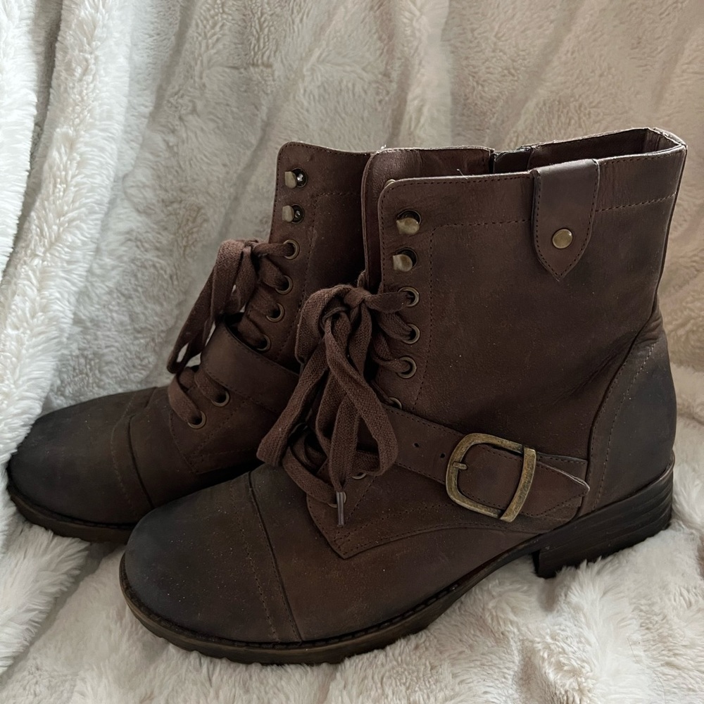 Ankle boots with buckle accent.